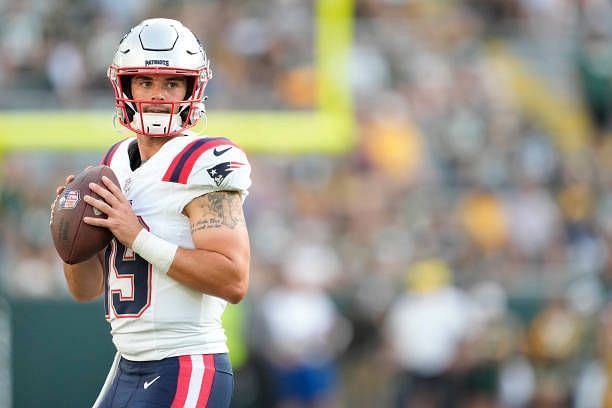 Trace McSorley of the New England Patriots warms up before a preseason game against the Green Bay Packers at Lambeau Field on August 19, 2023 in...