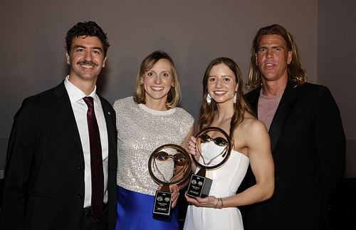 Katie Ledecky (2ndL) and Kate Douglass (2ndR) Female Athletes of the Year pose with presenters Anthony Ervin (L) and Gary Hall Jr. during the 2023 Golden Goggle Awards at JW Marriott LA Live on November 19, 2023 in Los Angeles, California.