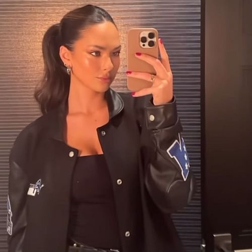 Christen Harper wearing a custom Jeff Hamilton Detroit Lions jacket.