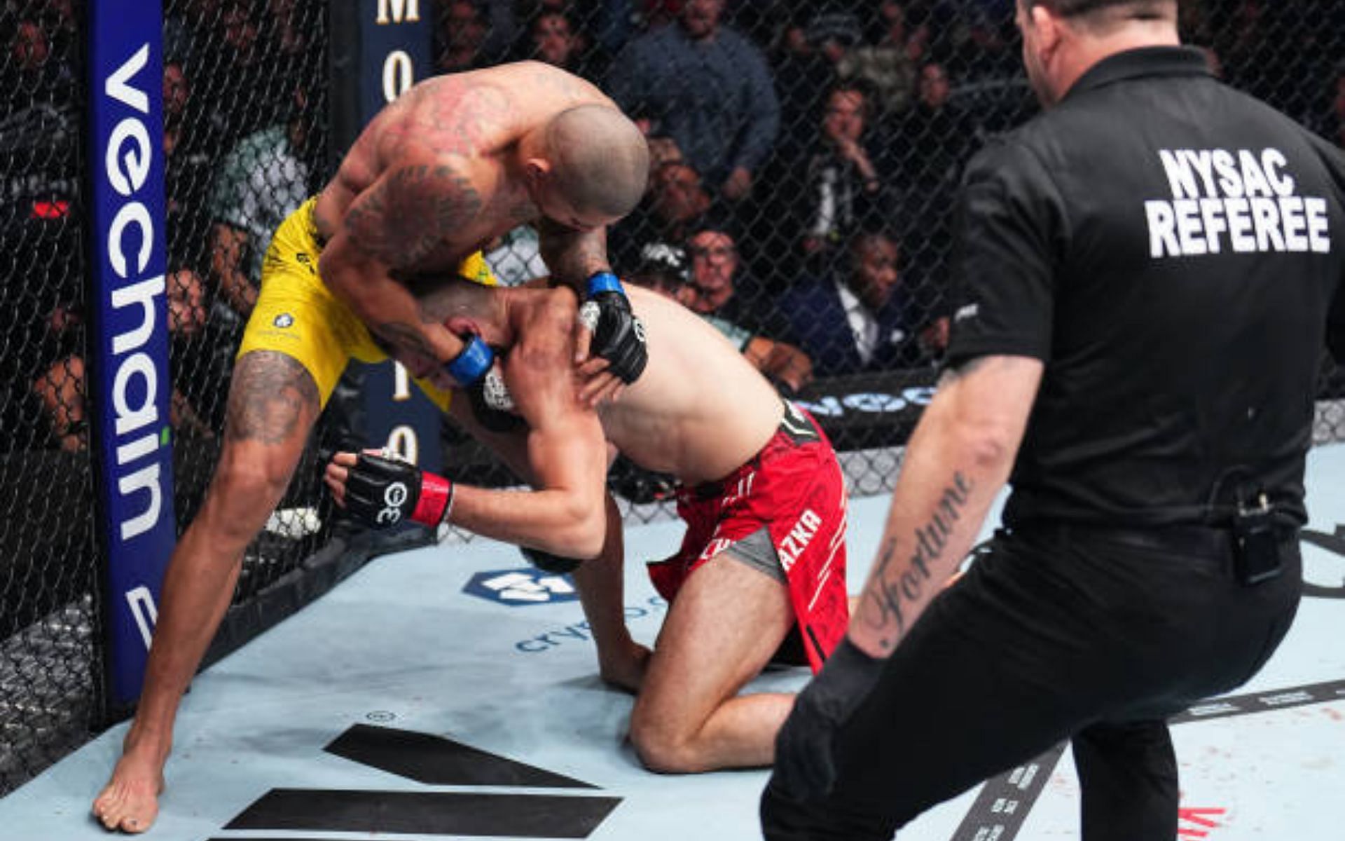 Marc Goddard prepares to stop Jiri Prochazka vs. Alex Pereira [image courtesy of Chris Unger/Zuffa LLC via Getty Images]