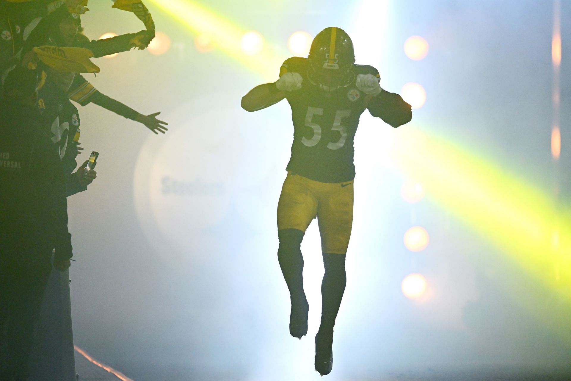 Cole Holcomb running out of the tunnel before Tennessee Titans v Pittsburgh Steelers