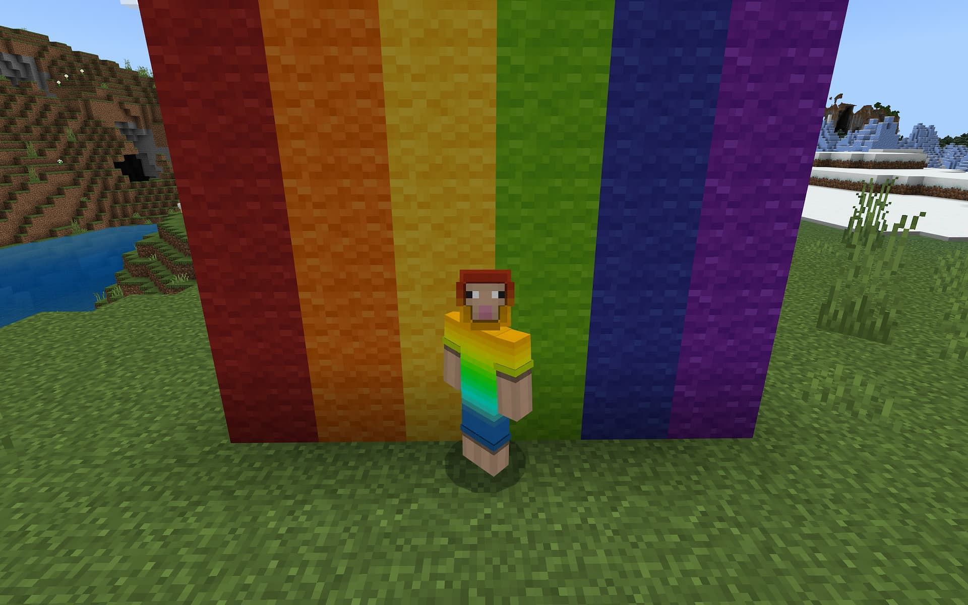 A rainbow sheep avatar stands in front of a rainbow made out of colored wool in Minecraft.