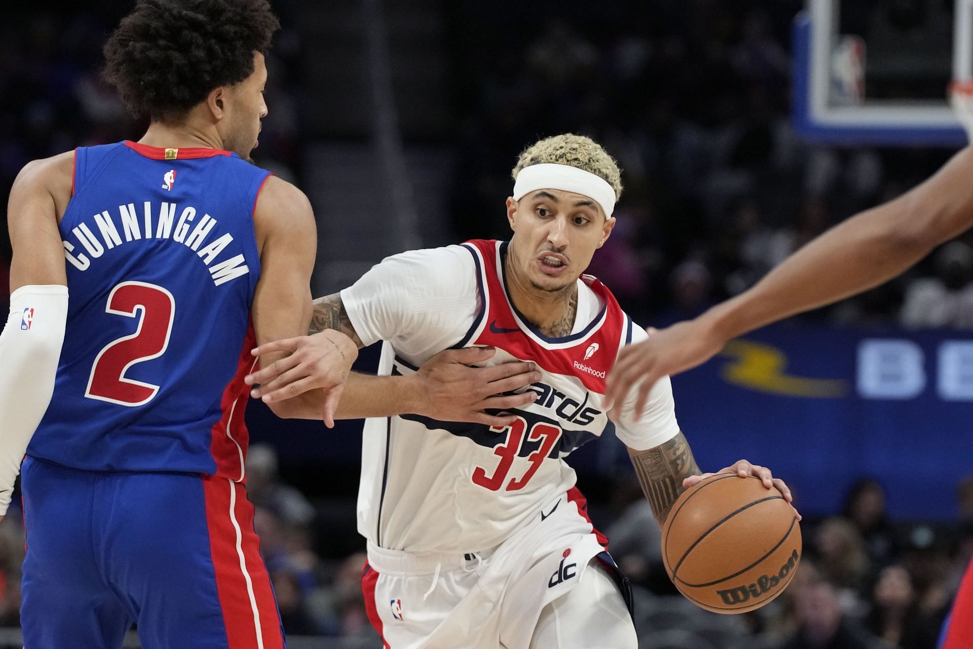 Kyle Kuzma of the Washington Wizards and Cade Cunningham of the Detroit Pistons