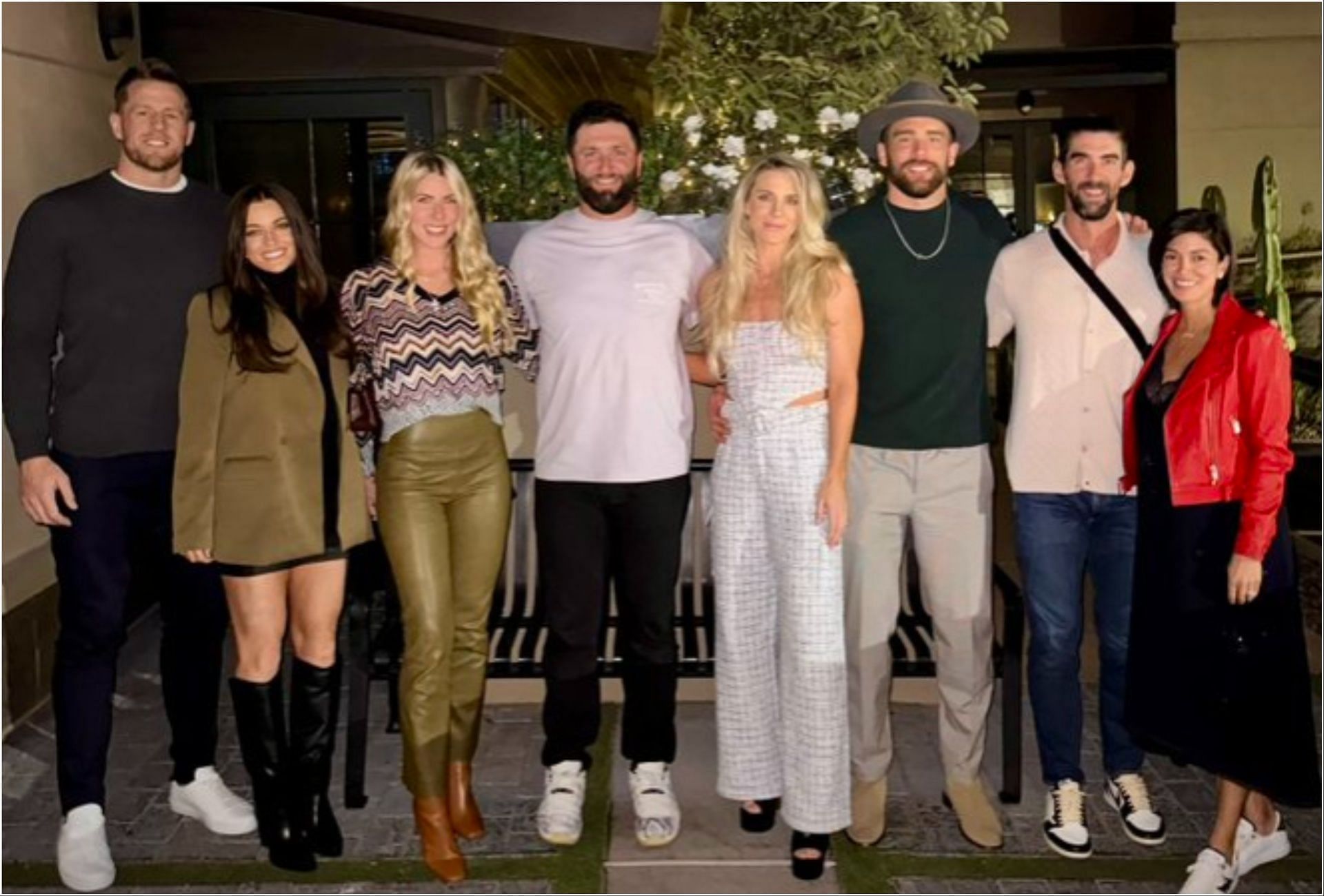 JJ Watt and his wife, Jon Rahm and his wife, Zach Ertz and his wife, and Michael Phelps family with Michael Phelps and his wife (via Getty Images)