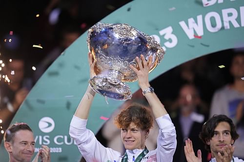 Jannik Sinner lifts the Davis Cup trophy.