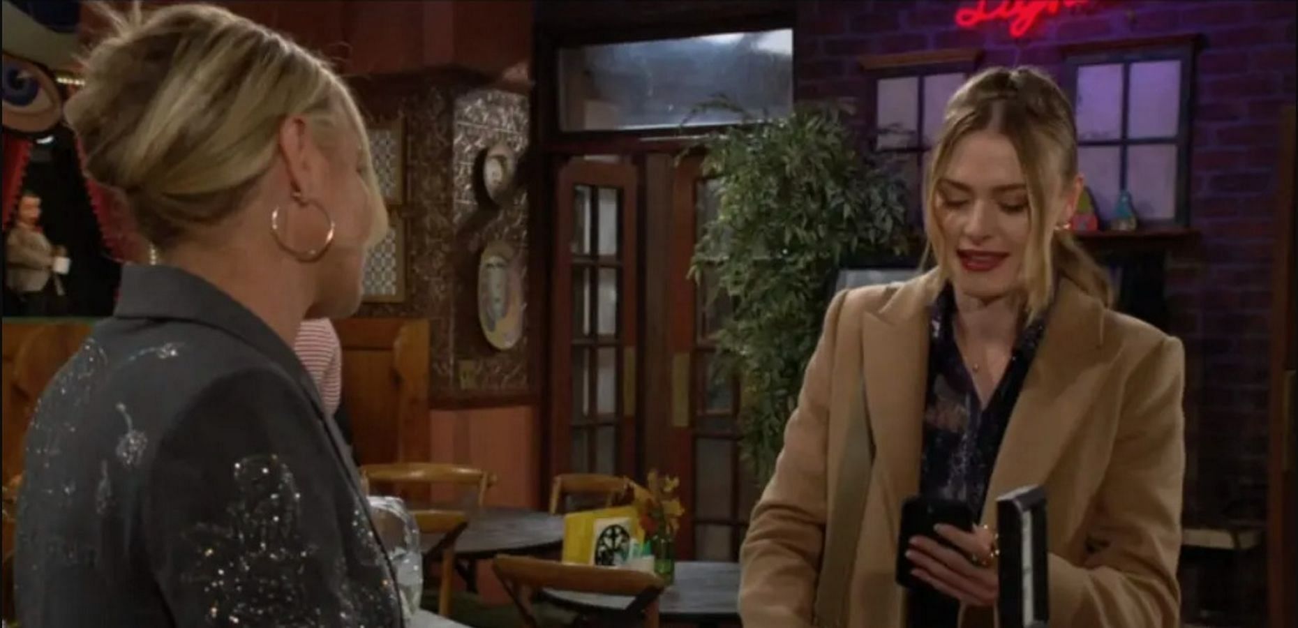 Claire gets the mysterious phone call while in conversation with Sharon (Image via CBS)