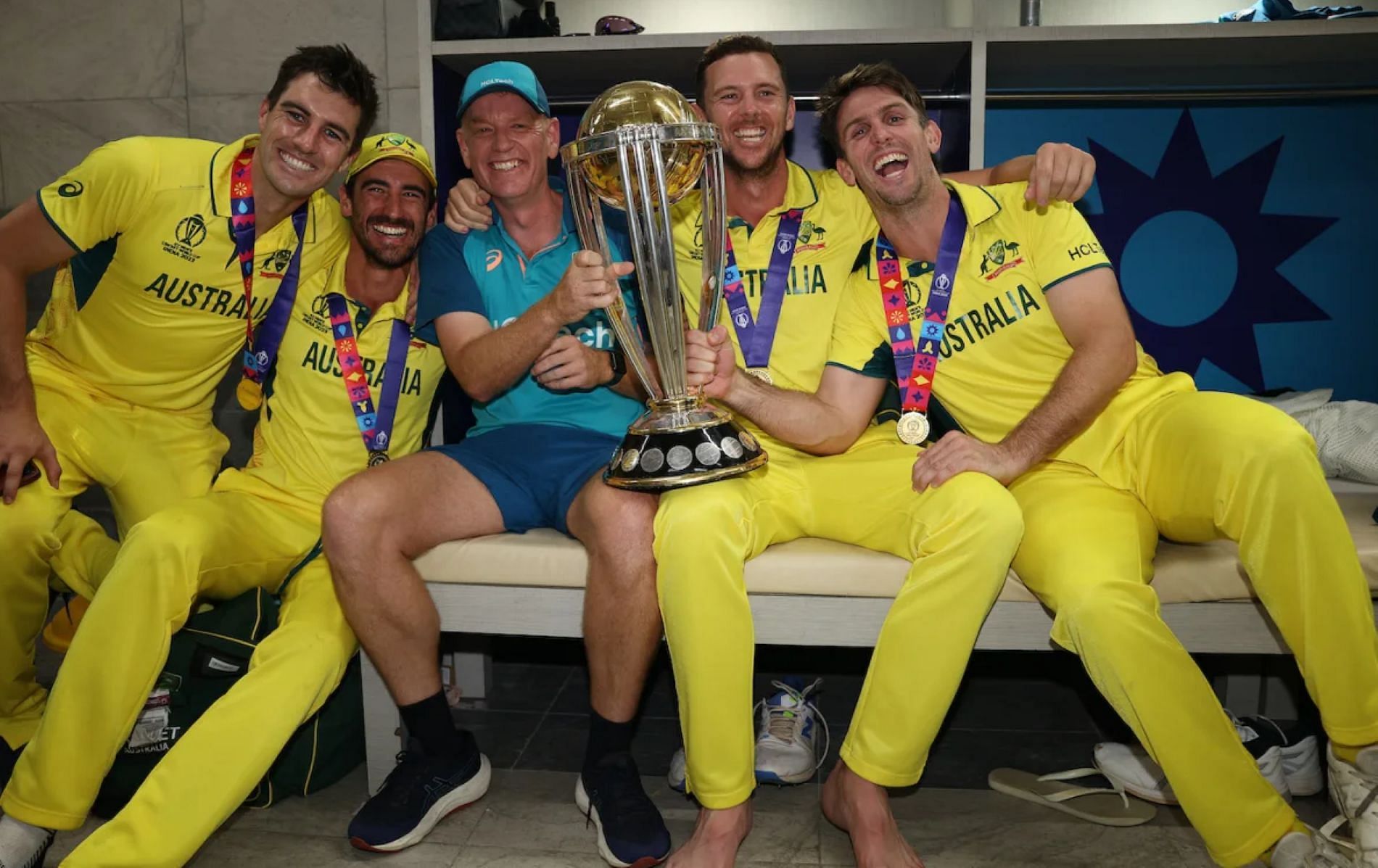 Australian players pose with the World Cup Trophy.