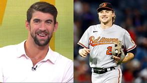 Michael Phelps congratulates Baltimore Orioles' Gunnar Henderson on winning MLB's Rookie of the Year award