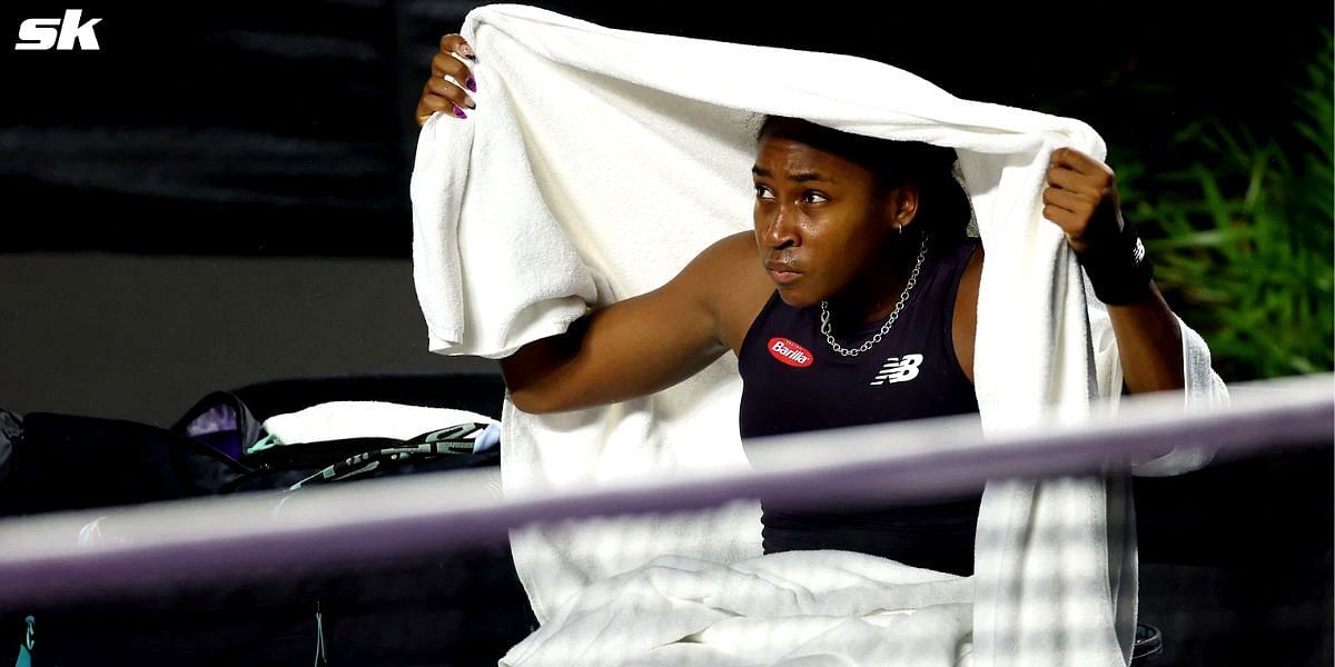 Coco Gauff protects herself from rain in Cancun, Mexico.