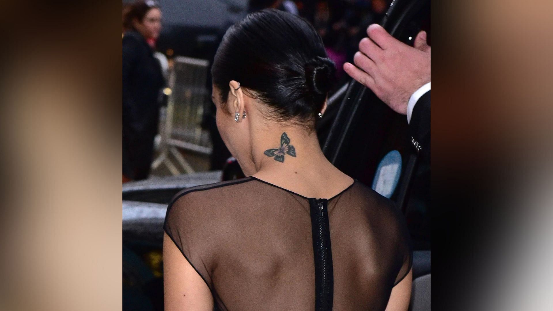 Hudgens&#039; butterfly tattoo on her neck