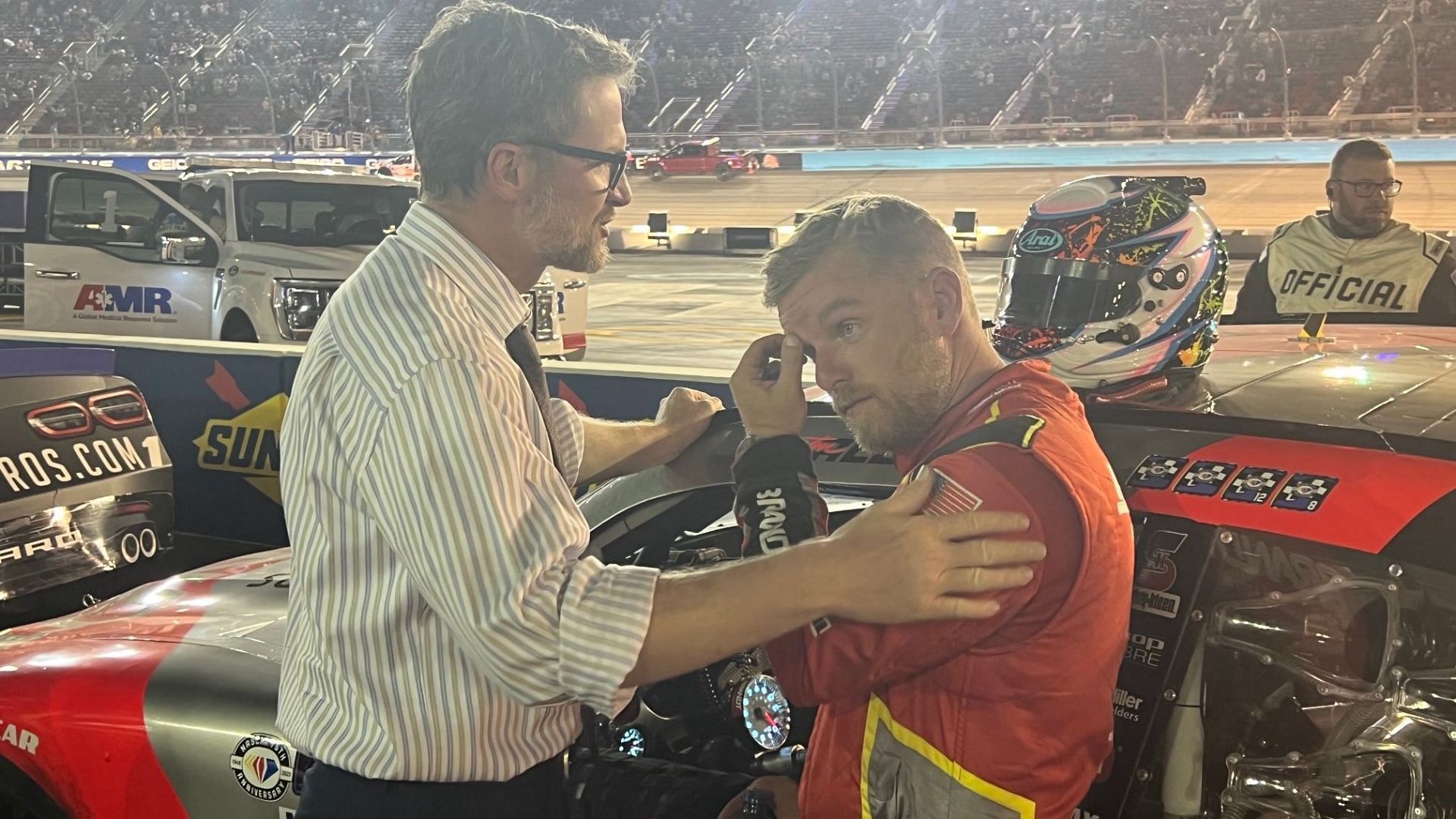 Dale Earnhardt Jr. consoles Justin Allgaier after the NASCAR Xfinity Series Championship Race in Phoenix