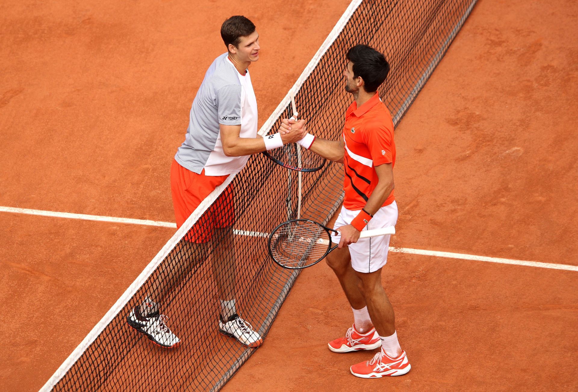 Hubert Hurkacz and Novak Djokovic at the 2019 French Open