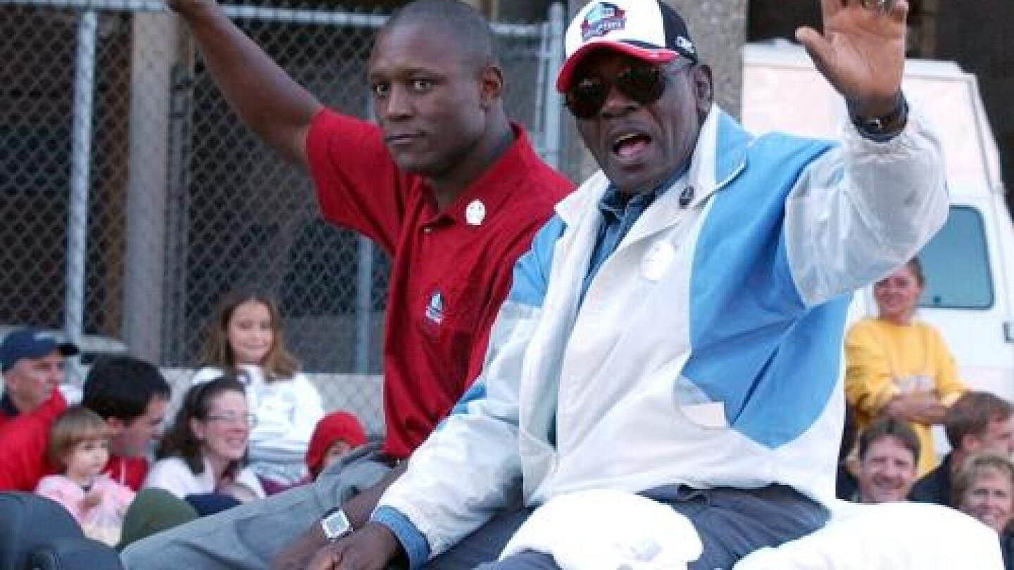 Barry Sanders (L) with his father William Sanders