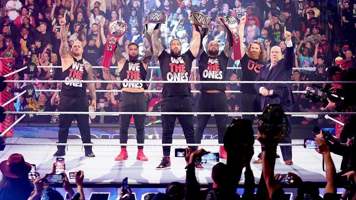 Left to right: Solo Sikoa, Jey Uso, Roman Reigns, Jimmy Uso, Sami Zayn, and Paul Heyman