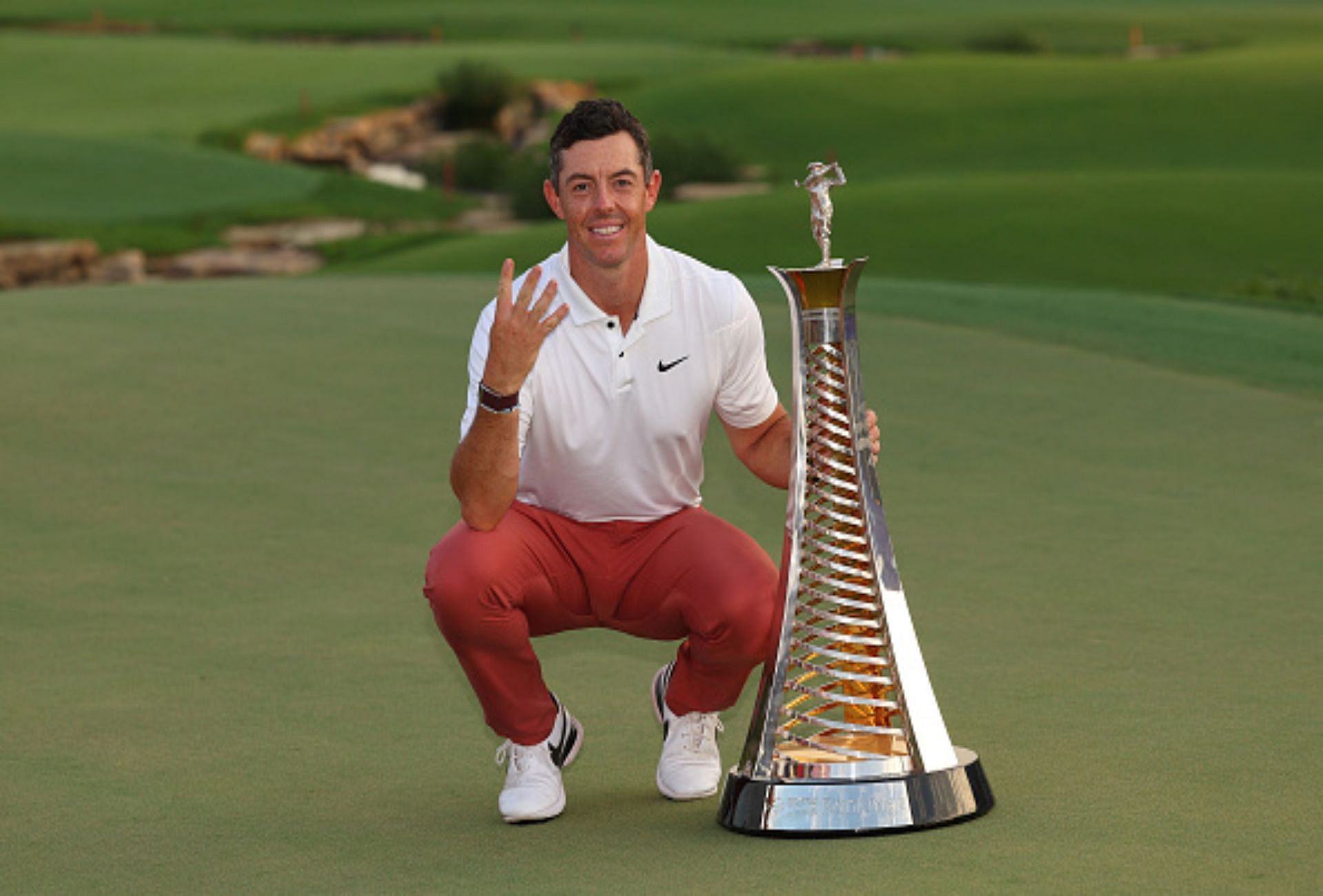 Rory McIlroy with his 2022 DP World Tour Championship trophy (Image via Getty).