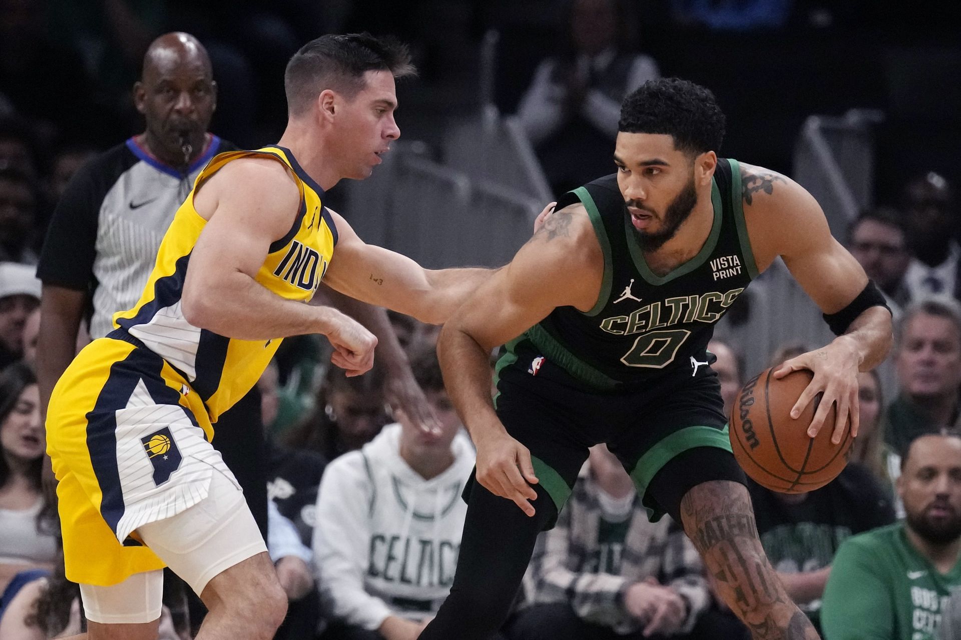 Indiana Pacers reserve point guard T.J. McConnell and Boston Celtics superstar forward Jayson Tatum