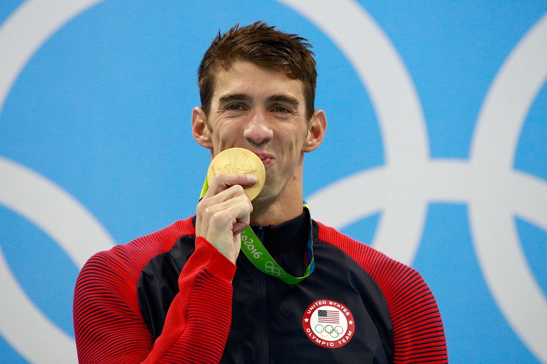 Gold medalist Michael Phelps of the United States celebrates on the podium during the medal ceremony for the Men&#039;s 200m Individual Medley Final at the Rio 2016 Olympic Games in Rio de Janeiro, Brazil.