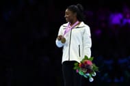 Gold Medalist Simone Biles of the USA poses for photographs on the podium for the Women's Floor Final during the 2023 Artistic Gymnastics World Championships in Antwerp, Belgium.