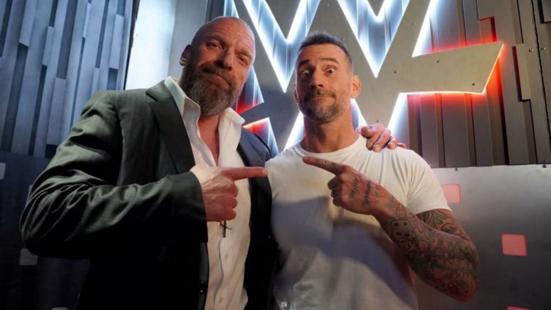 CM Punk with WWE Chief Content Officer Triple H