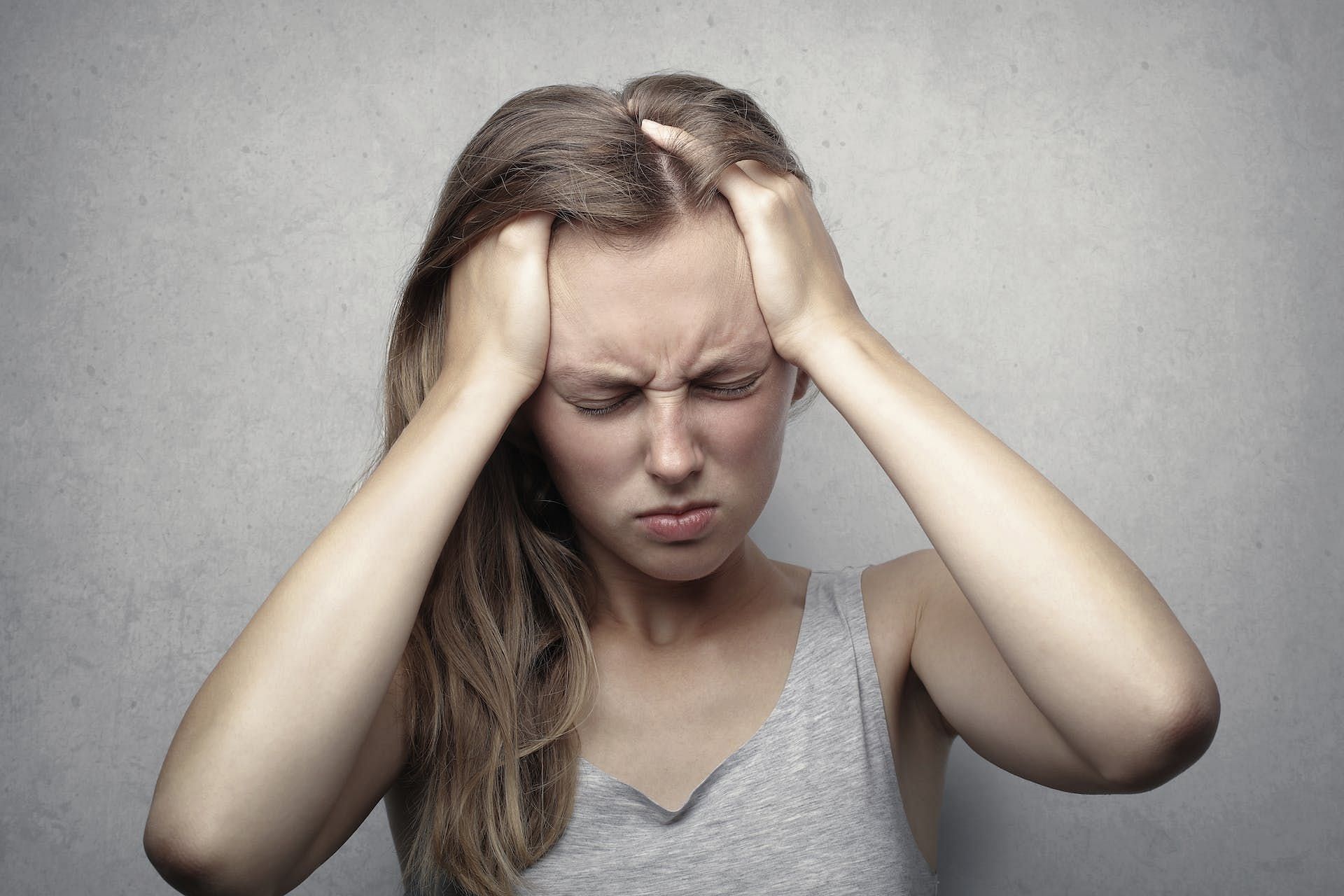 Headaches can also happen as a result of low blood sugar. (Image via Pexels/Andrea Piacquadio)