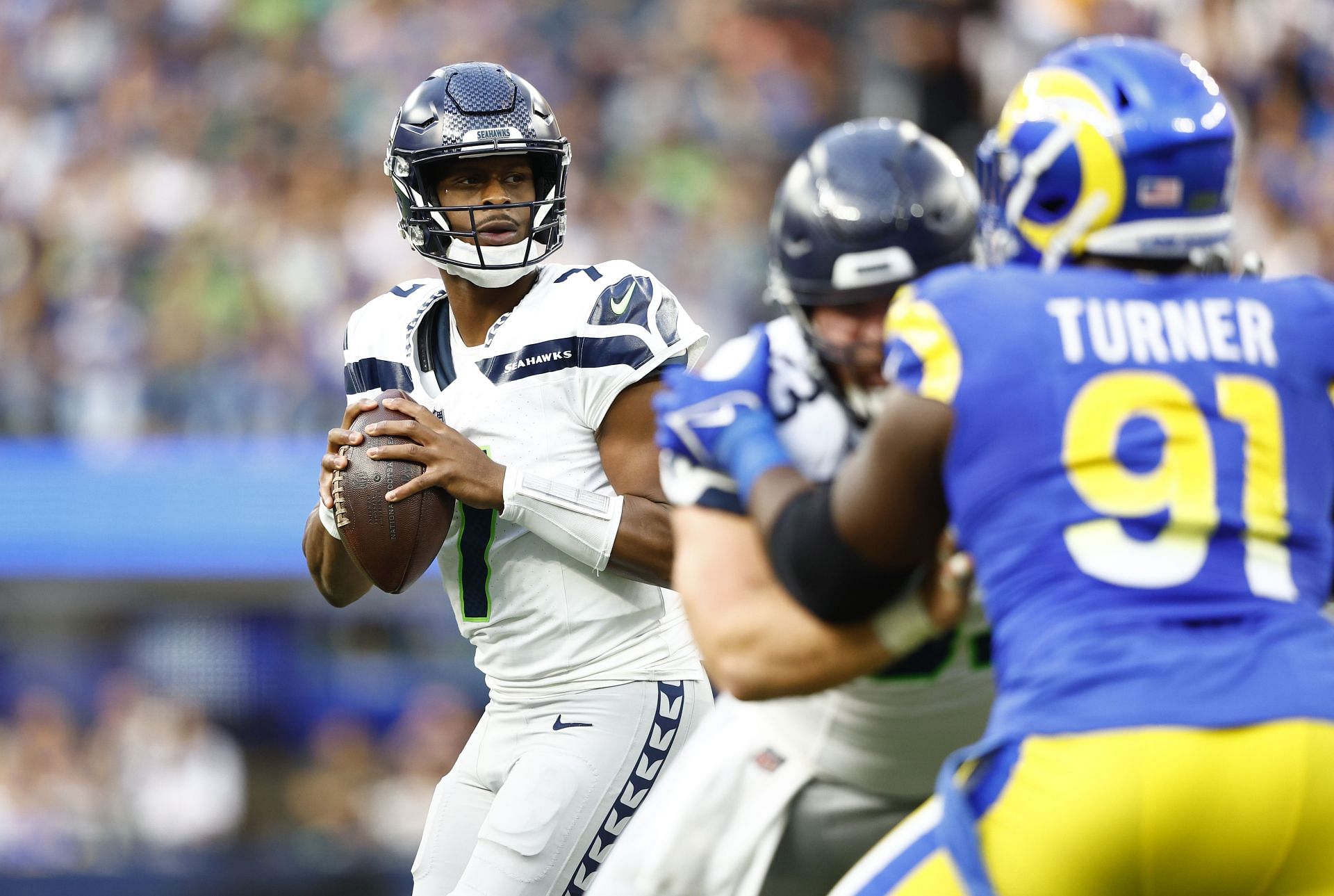 Geno Smith seeks a pass vs the Los Angeles Rams