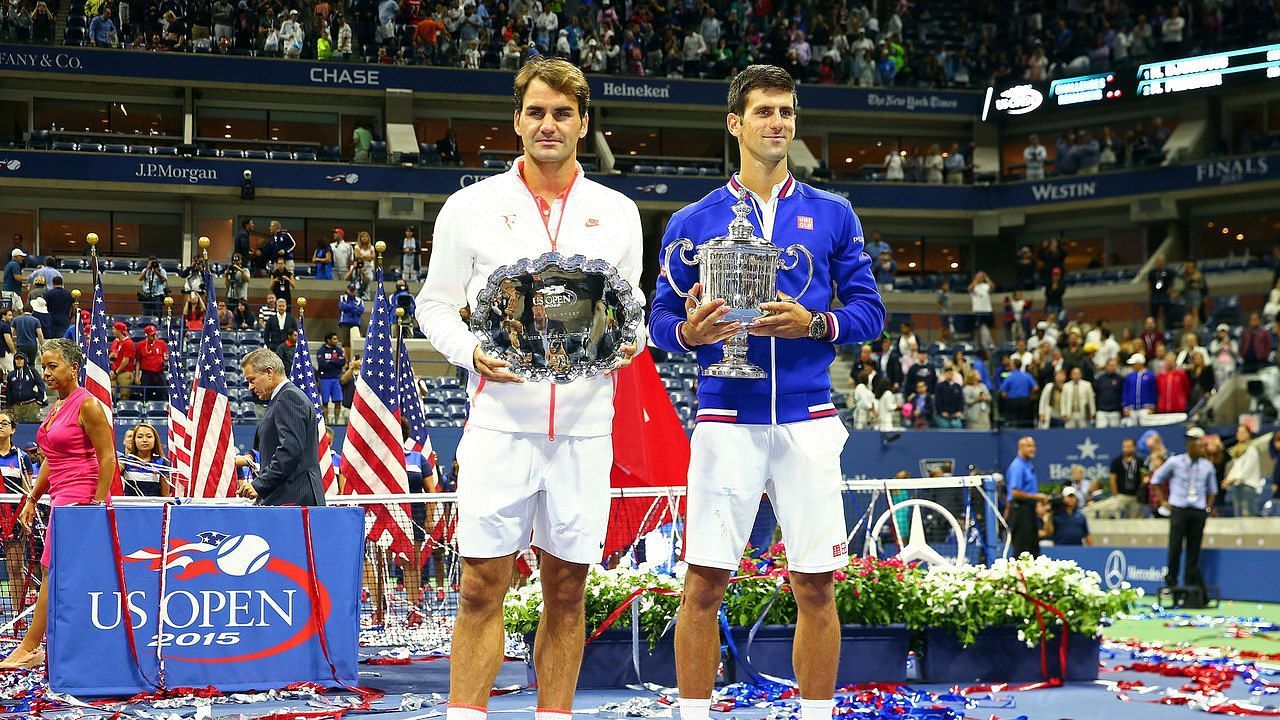 Roger Federer (L) and Novak Djokovic at the 2015 US Open trophy ceremony