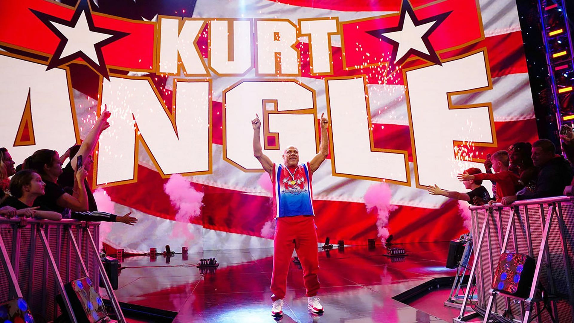 Kurt Angle heads to the WWE ring to a standing ovation