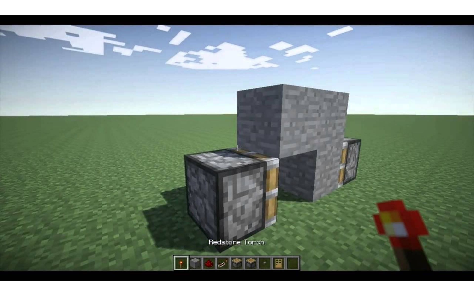 A fun solution is simply adding a button to activate a hidden door (Image via YouTube/Squidz)