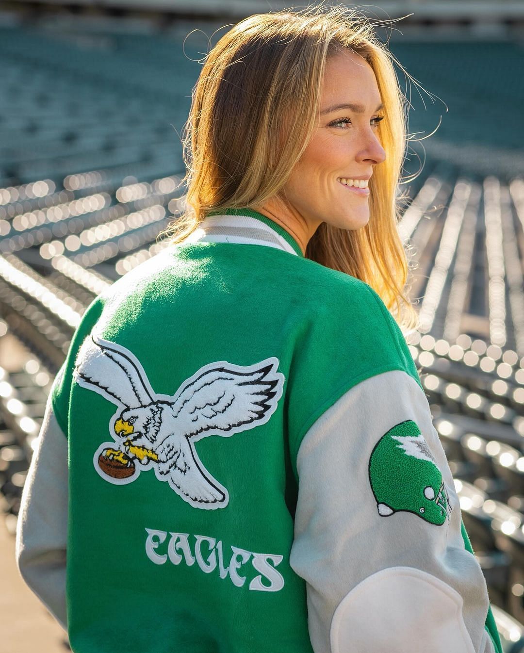 Kylie Kelce showing off the back of the jacket.