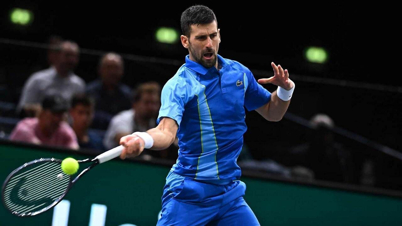 The Serb hits a forehand at the 2023 Paris Masters