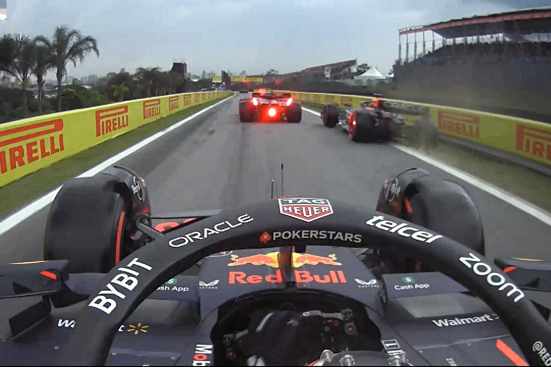 Max Verstappen overtaking Sergio Perez and other cars in pit exit during 2023 F1 Brazilian Grand Prix qualifying session (Image via Sportskeeda)