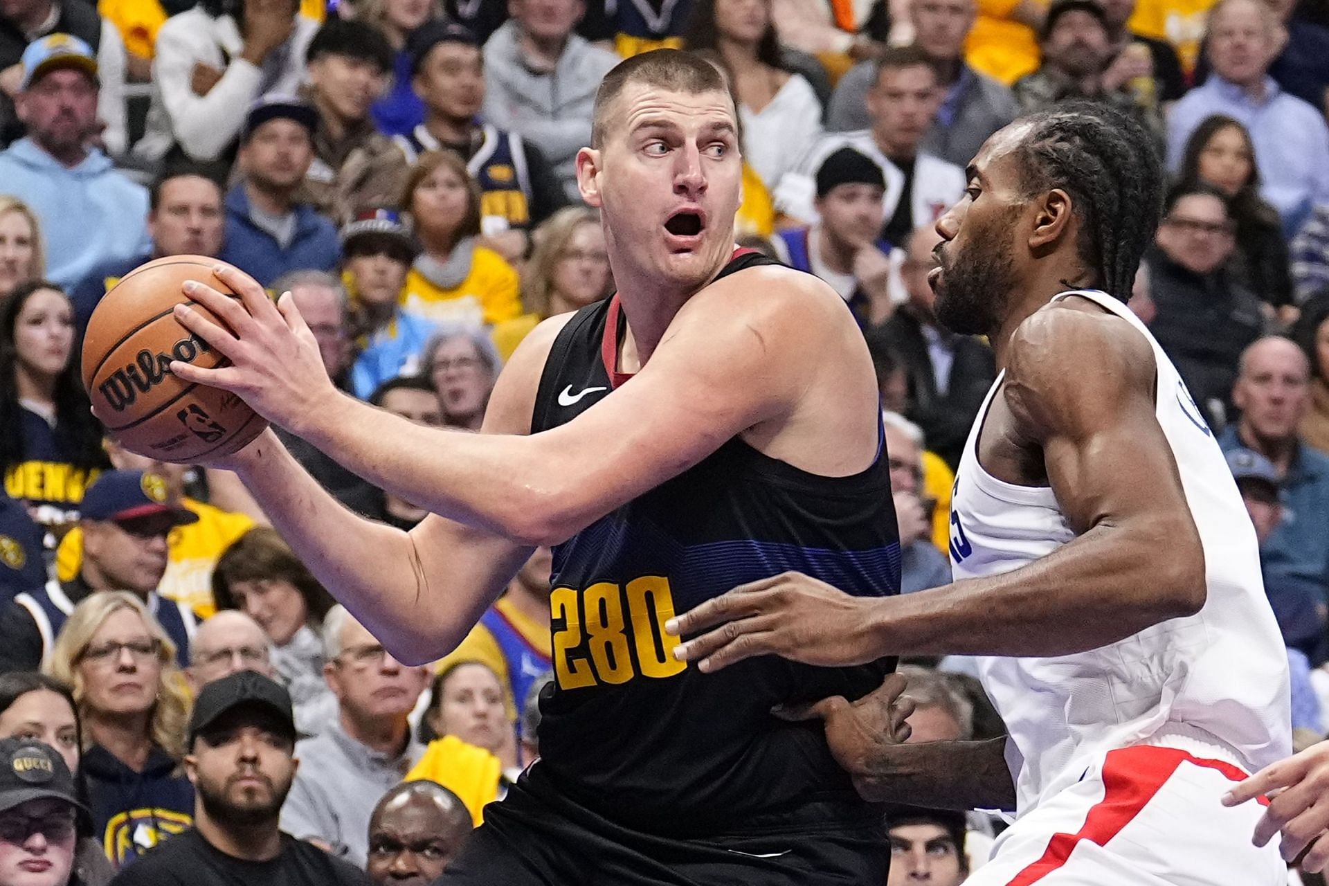 Kawhi Leonard of the LA Clippers guarding Nikola Jokic of the Denver Nuggets