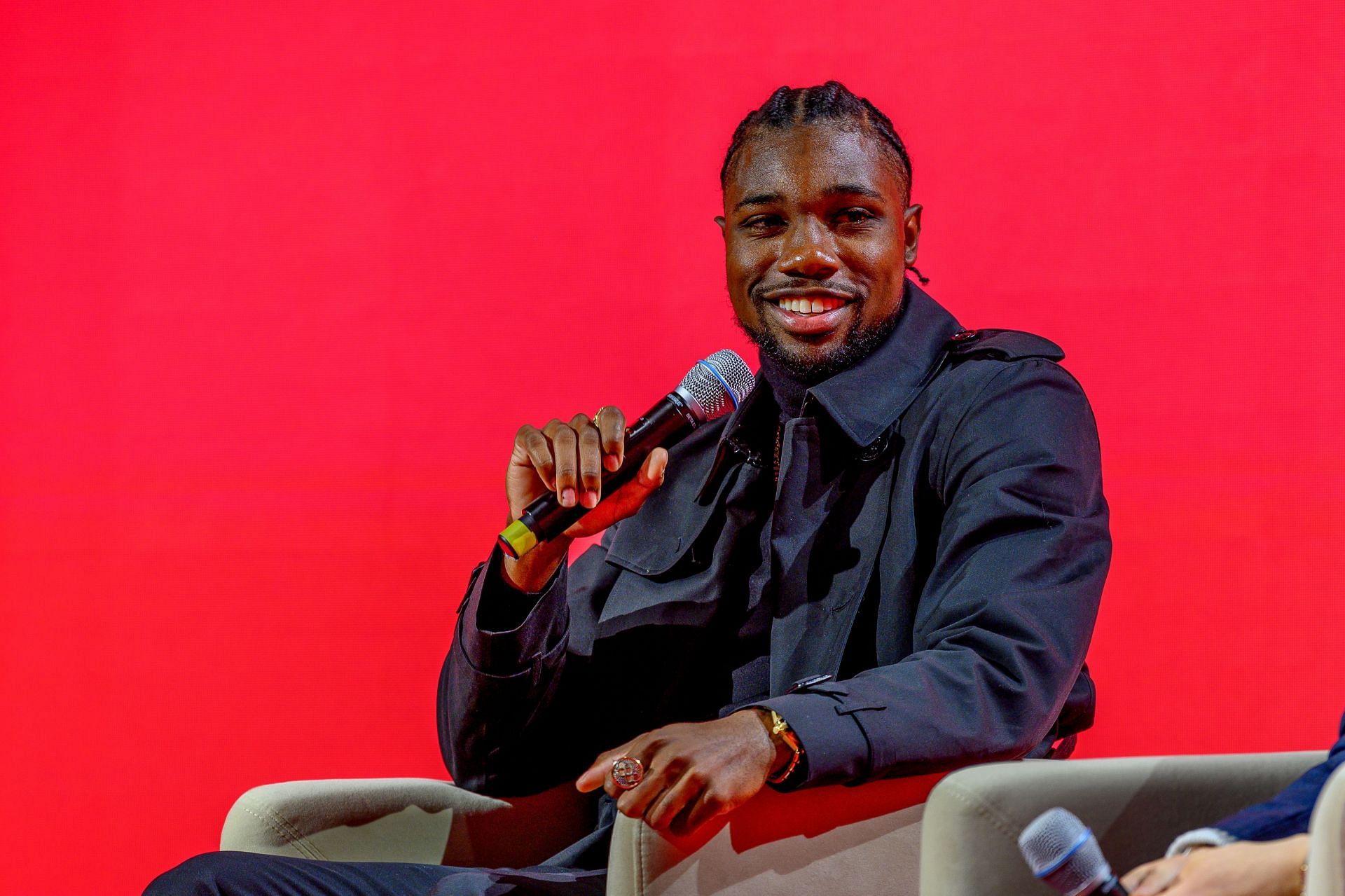 Noah Lyles on stage during the OMEGA panel discussion with Olympic ambassadors in New York City.