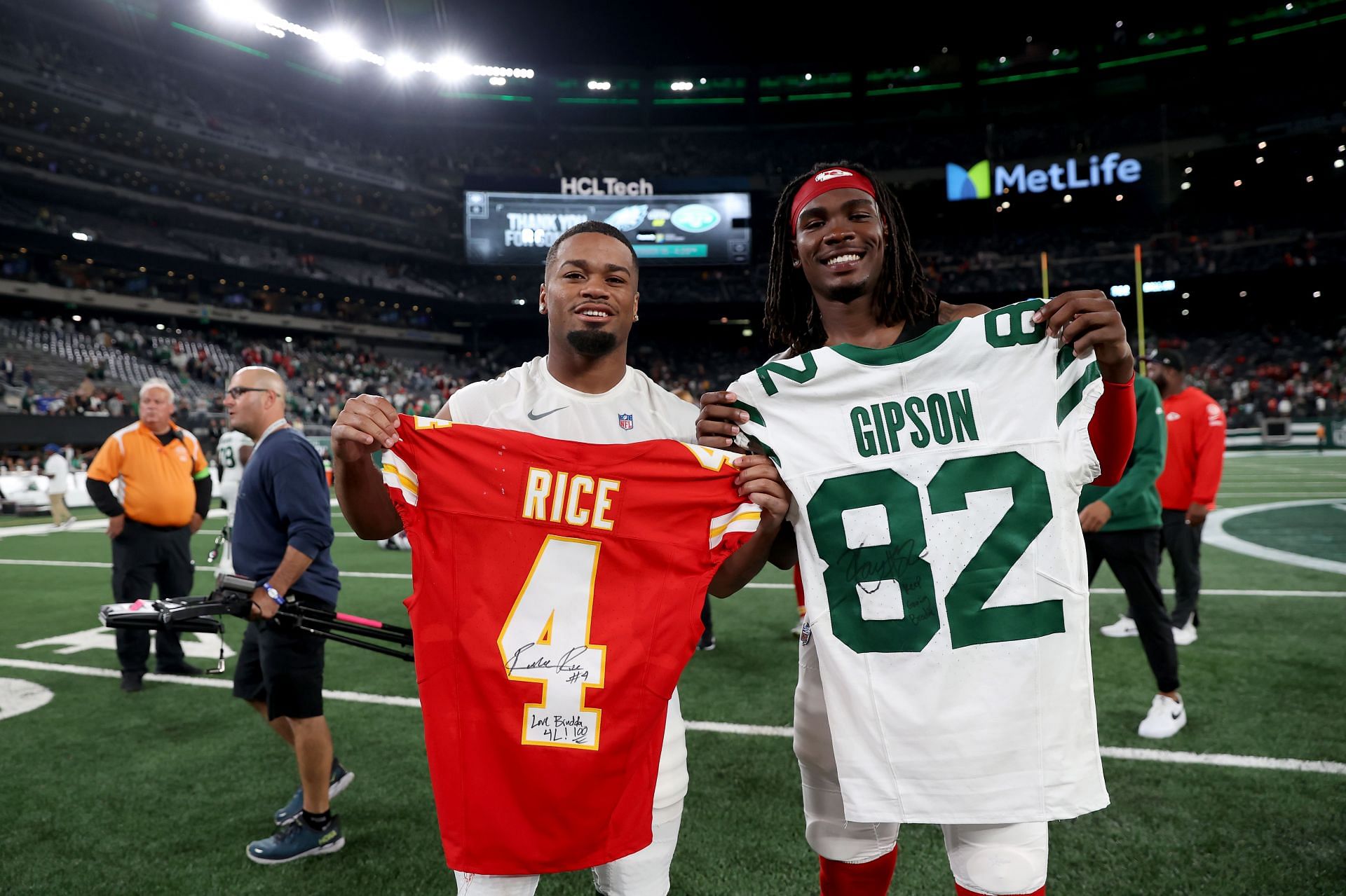 Rice (right) exchanges jerseys at Kansas City Chiefs vs. New York Jets