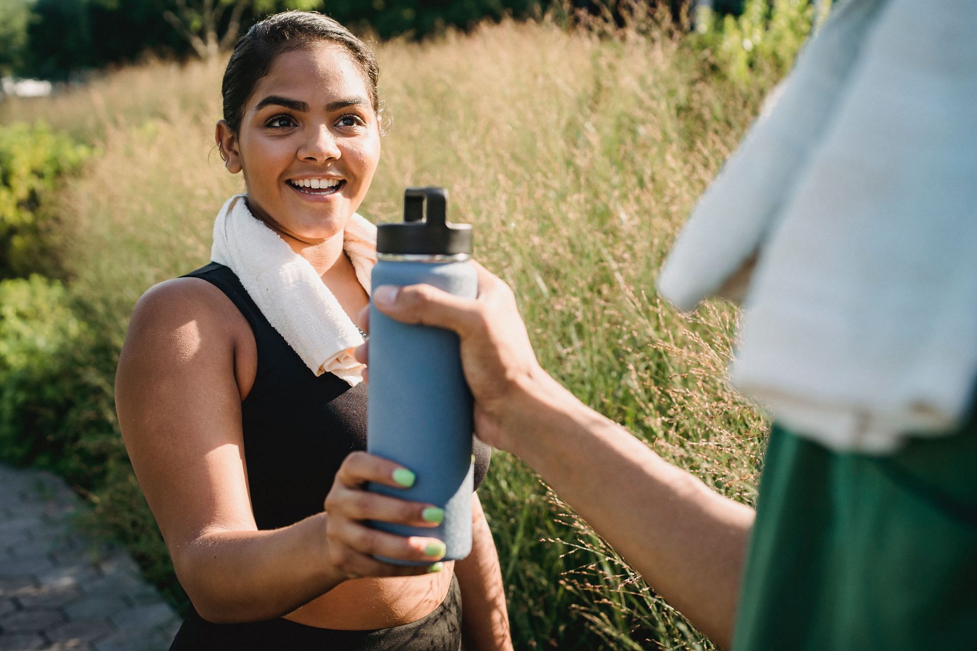 Importance of hydration to tighten excess skin after pregnancy (Image sourced via pexels / Photo by Ketut)