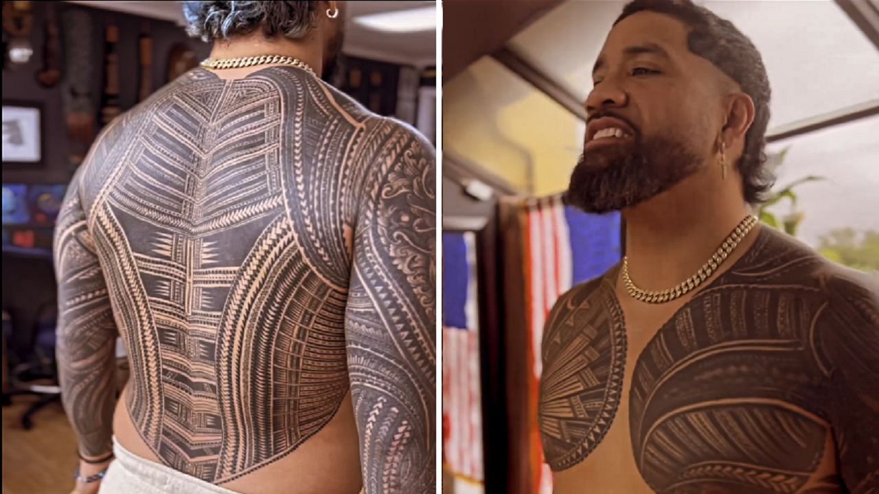 Jey Uso showing off his back tattoo