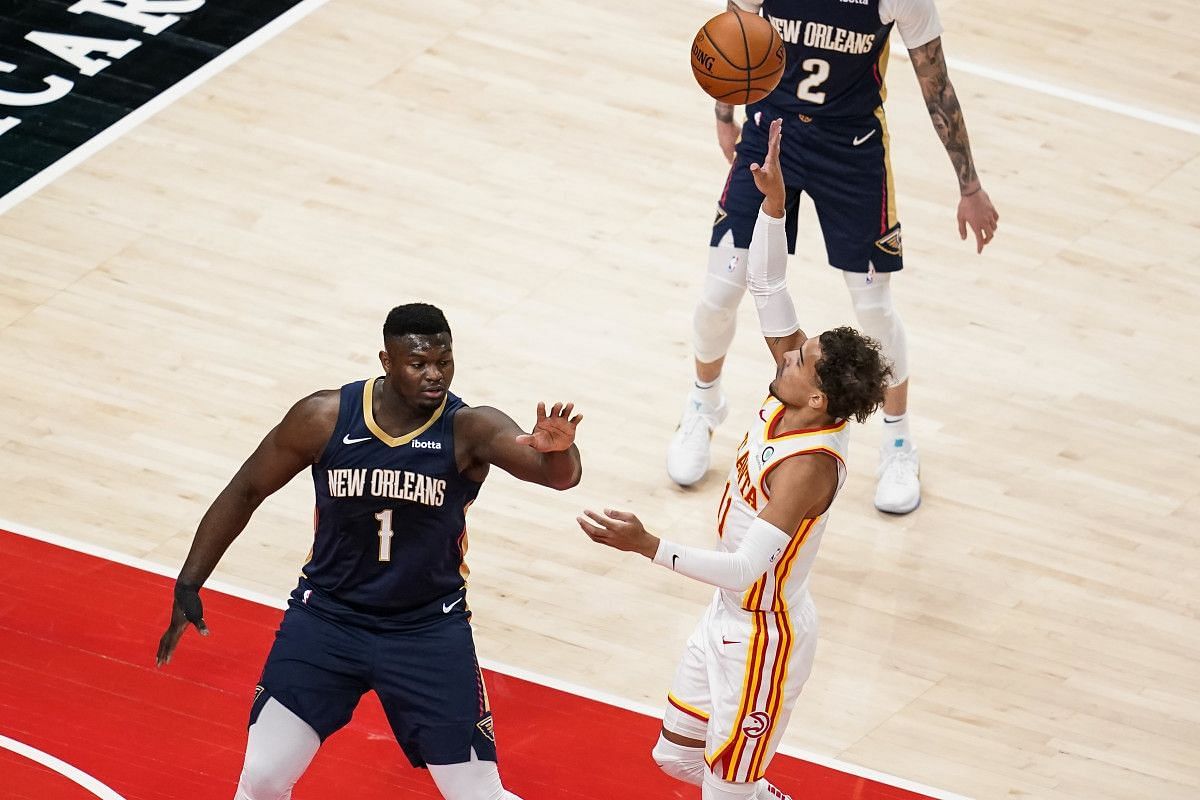 Zion Williamson of the New Orleans Pelicans contests a floater by Trae Young of the Atlanta Hawks 