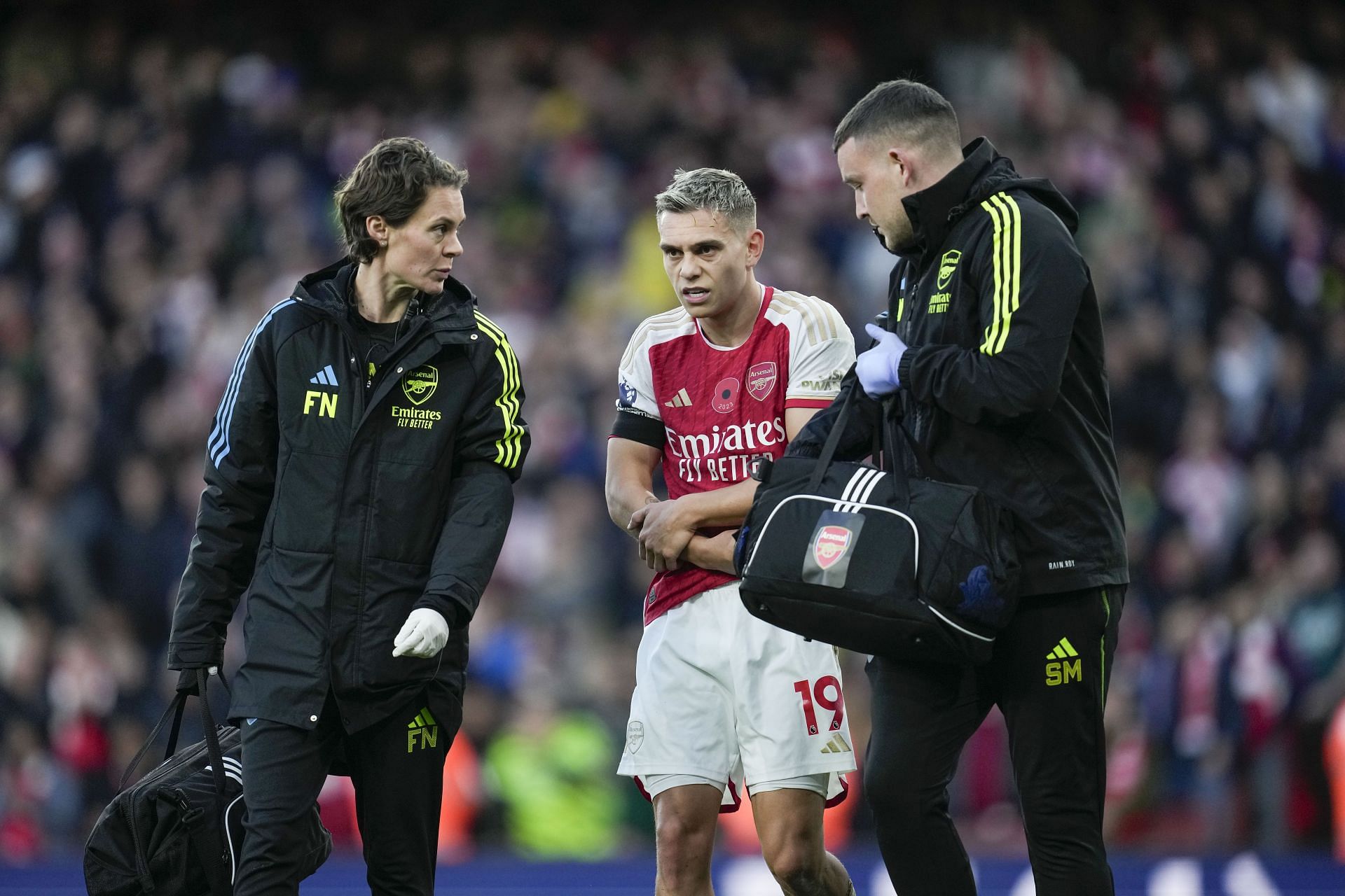 Trossard receives treatment from Arsenal&#039;s physios after scoring the first goal of the game.