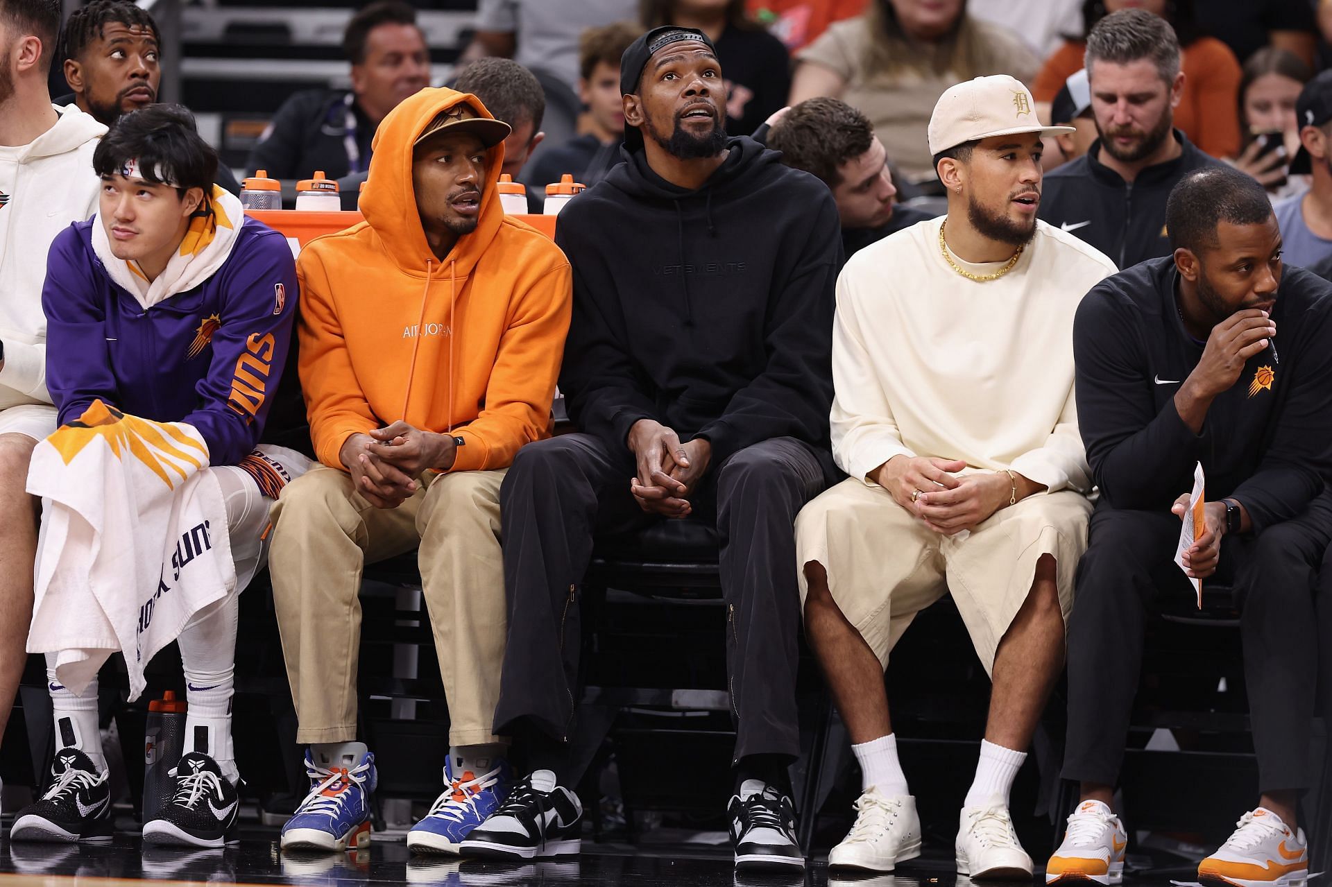 (L-R) Yuta Watanabe, Bradley Beal, Kevin Durant and Devin Booker of the Phoenix Suns on the bench