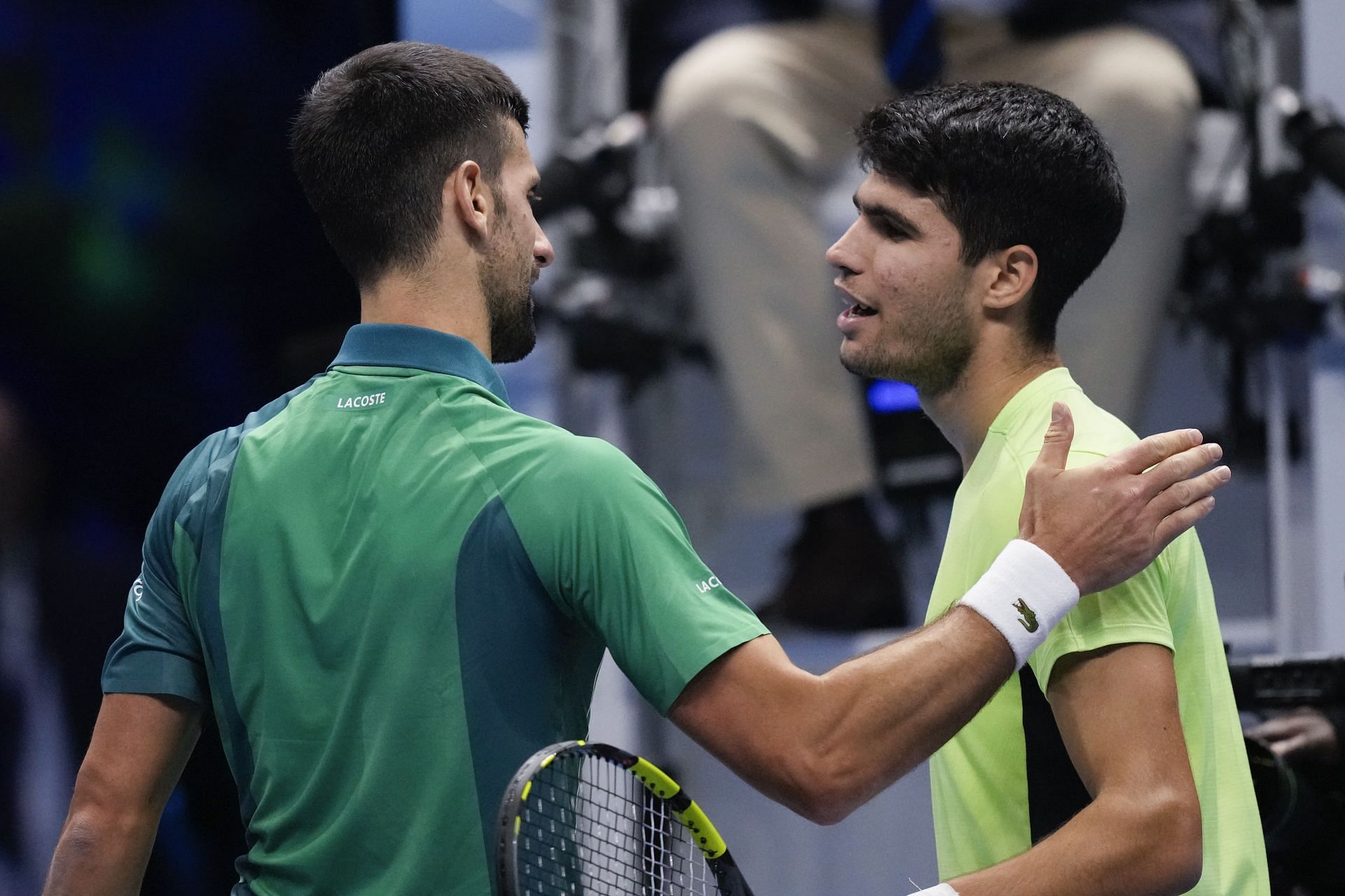 Carlos Alcaraz congratulates Novak Djokovic following their singles semi-final match at the ATP Finals