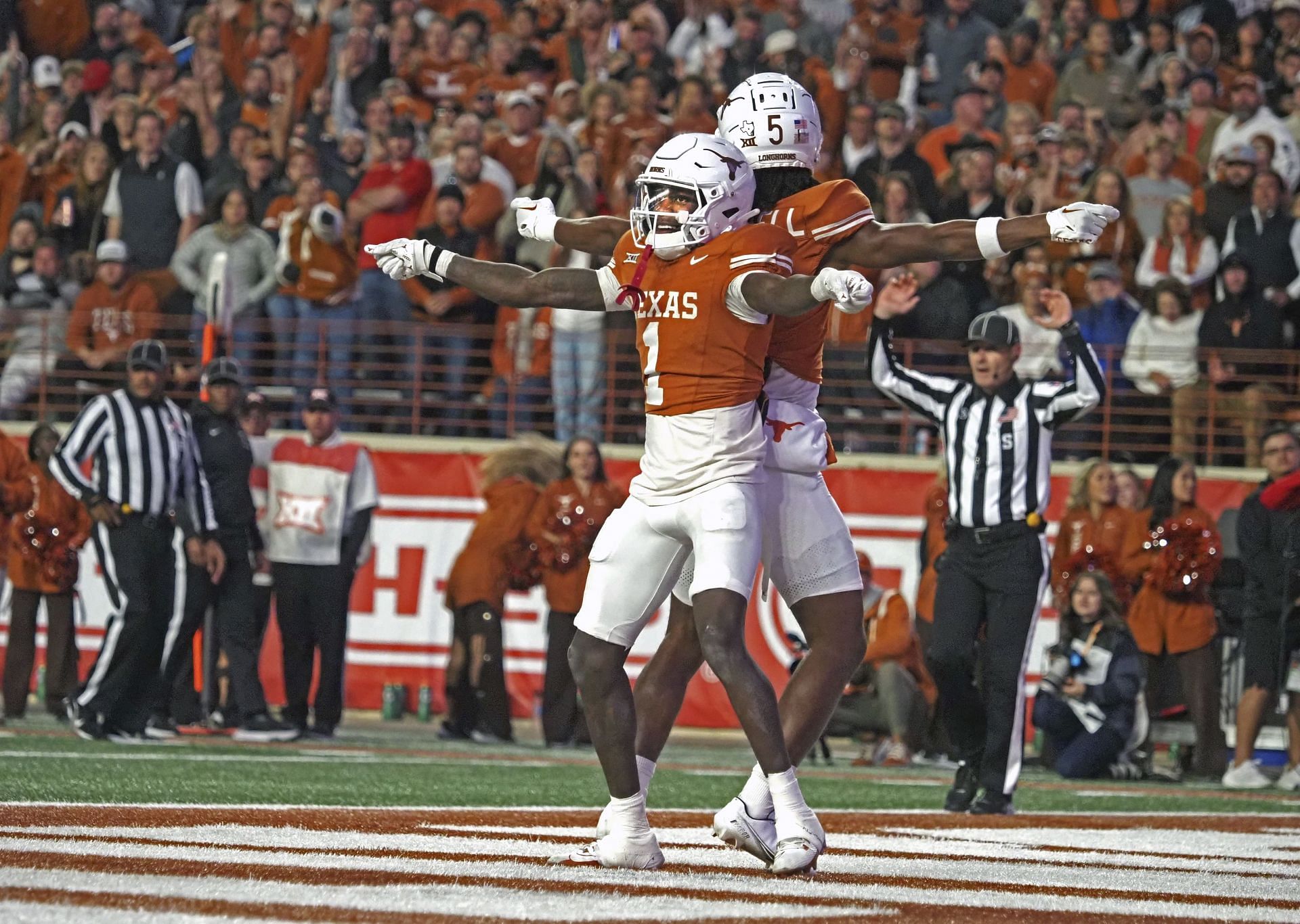 Texas Tech Texas Football: Texas wide receiver Xavier Worthy (1) celebrates after his touchdown catch with receiver Adonai Mitchell (5) during the second half of an NCAA college football game against Texas Tech, Friday, Nov. 24, 2023, in Austin, Texas. (AP Photo/Michael Thomas)