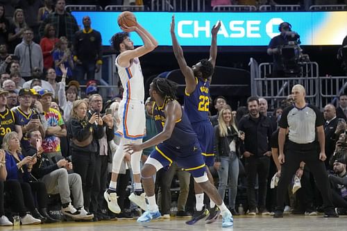 Chet Holmgren hitting the game-tying 3-point shot over Andrew Wiggins