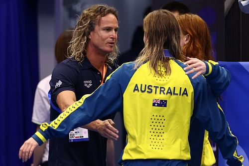 Australian swim coach Dean Boxall hugs silver medallist Ariarne Titmus and gold medallist Mollie O'Callaghan of Team Australia during the 2023 World Aquatics Championships in Fukuoka, Japan.