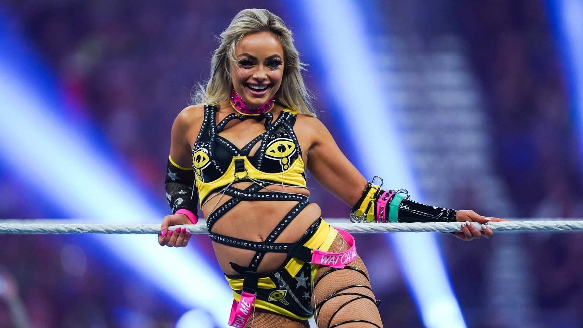 Liv Morgan poses for fans in the WWE ring