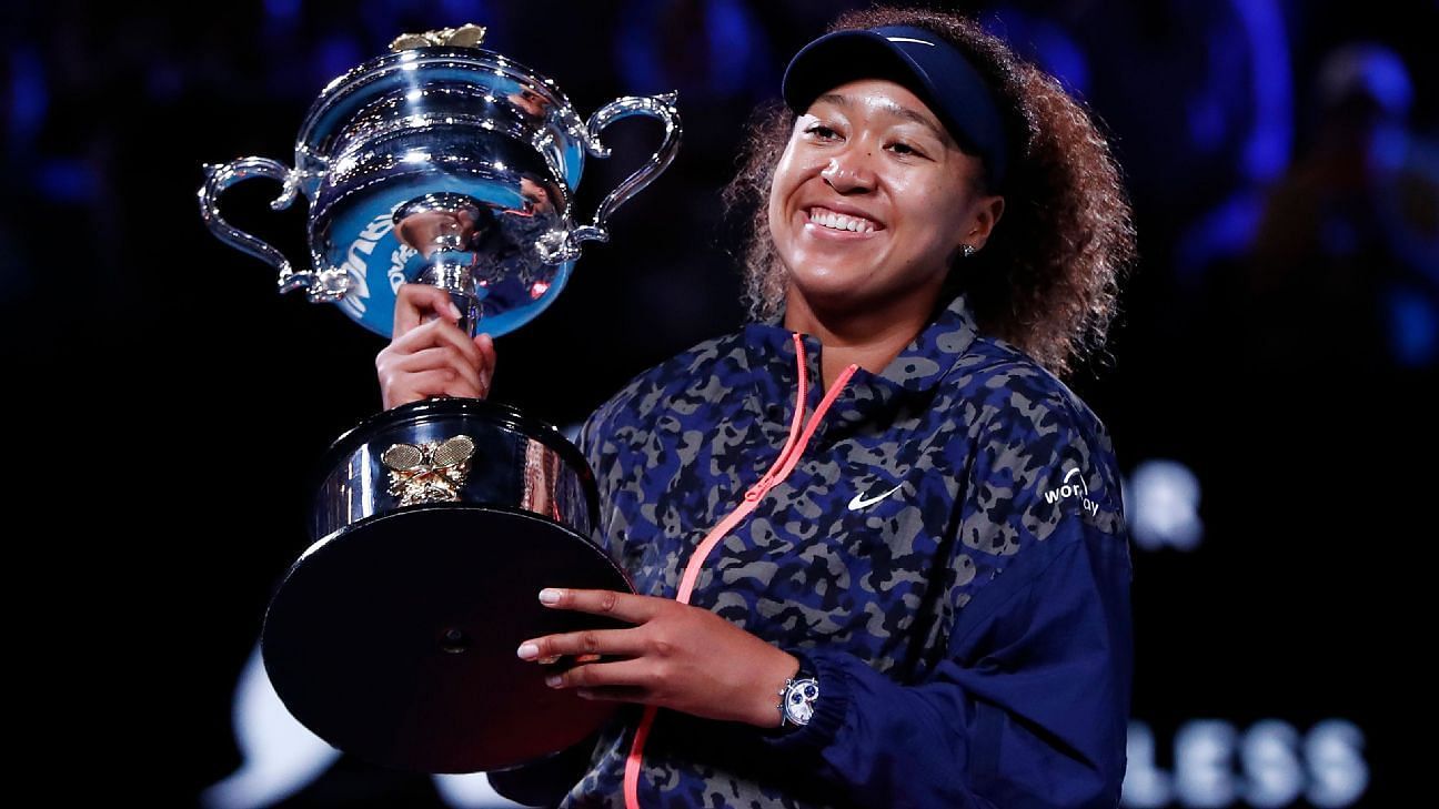 Naomi Osaka poses with the 2021 Australian Open title