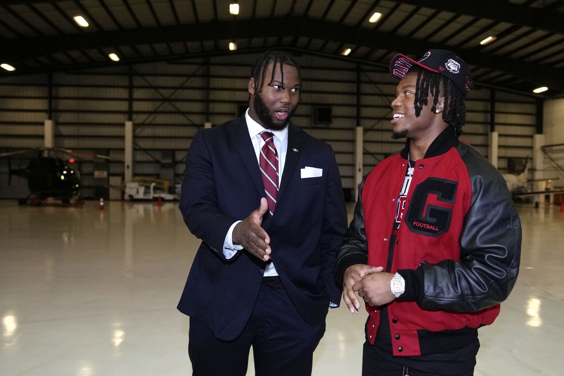 Georgia offensive lineman Sedrick Van Pran (left) speaks with defensive back Javon Bullard.