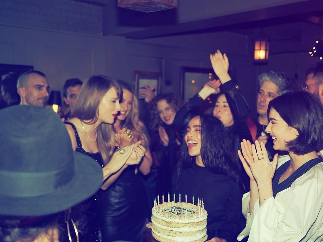 Actress Zoe Kravitz with the birthday cake for Swift. (Taylor Swift/IG)