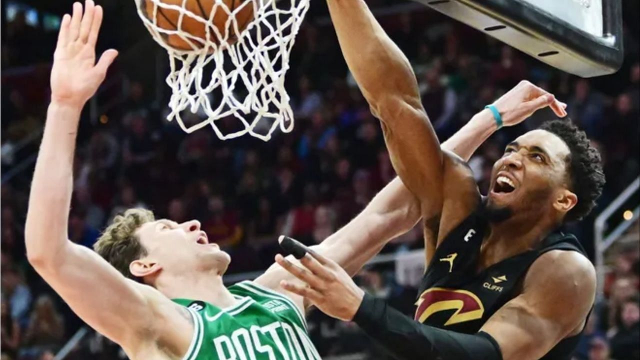 Donovan Mitchell dunking on Boston Celtics