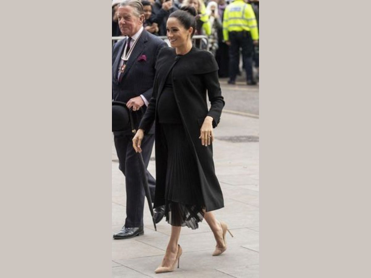 Megan in Black skirt ( Image via Pinterest/The Royal Pregnancy)