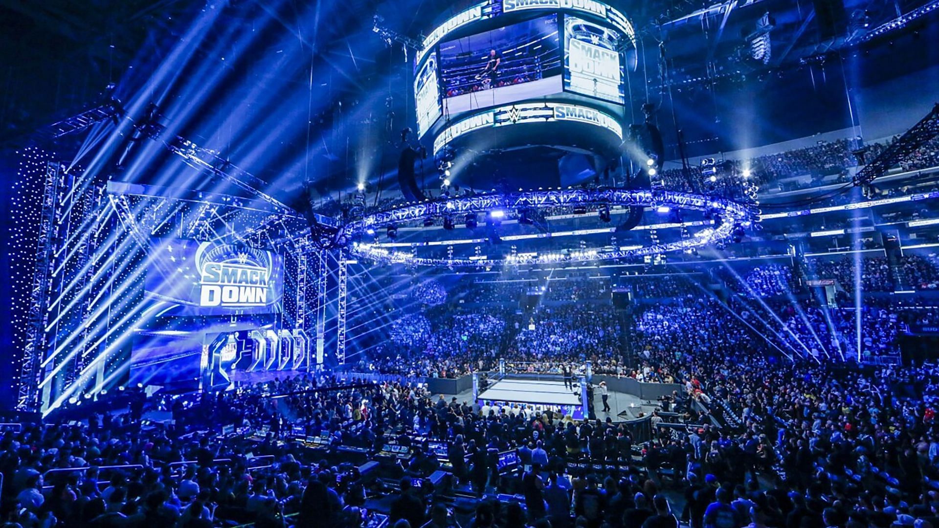 The WWE SmackDown logos and ring on display inside arena